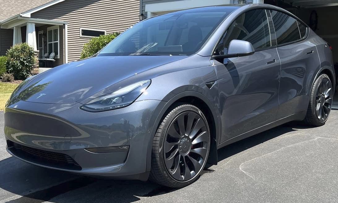 Detailer applying ceramic coating: Shielding the paint from the elements.