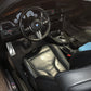 Interior view of BMW M4 from the driver’s side, showcasing the detailed and clean interior after our professional detailing service.