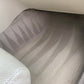 Triangle-shaped line art patterns on a vehicle’s carpet after professional interior detailing.
