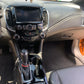 Cleaned and coated dashboard and center console of a vehicle after detailing.