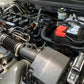 Deep-cleaned engine bay with rejuvenated plastic components, showcasing a like-new appearance.
