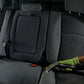Detailer's arm operating an extraction machine, effectively pulling out dirt from a dirty vehicle interior during a deep cleaning process.
