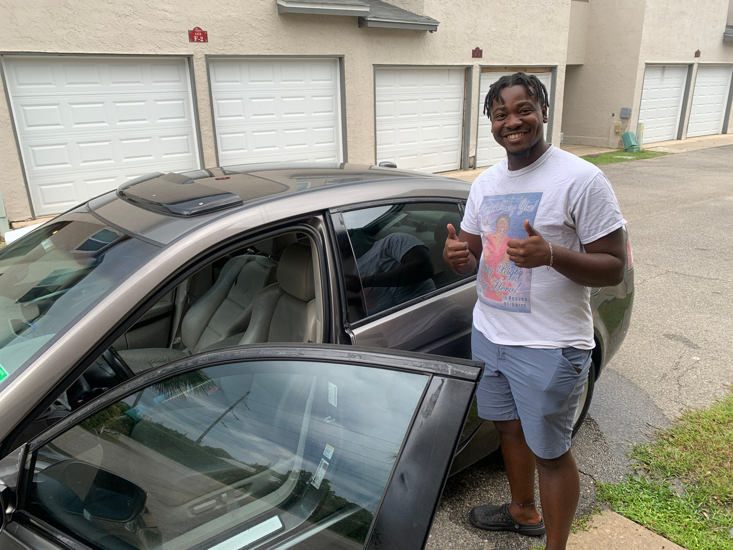 A delighted car owner with the results of our detailing expertise.