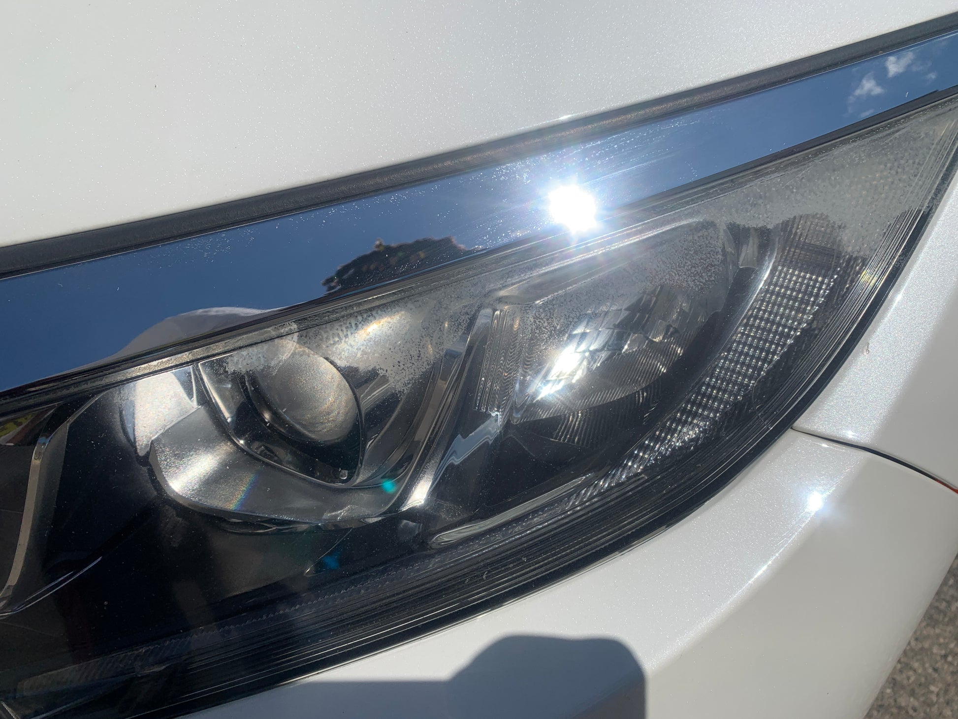 Headlight lens cleaning to remove haze and discoloration