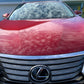 The glossy hood of a Lexus R350 reflecting the clouds, demonstrating the enhanced shine and protection from our ceramic coating package.