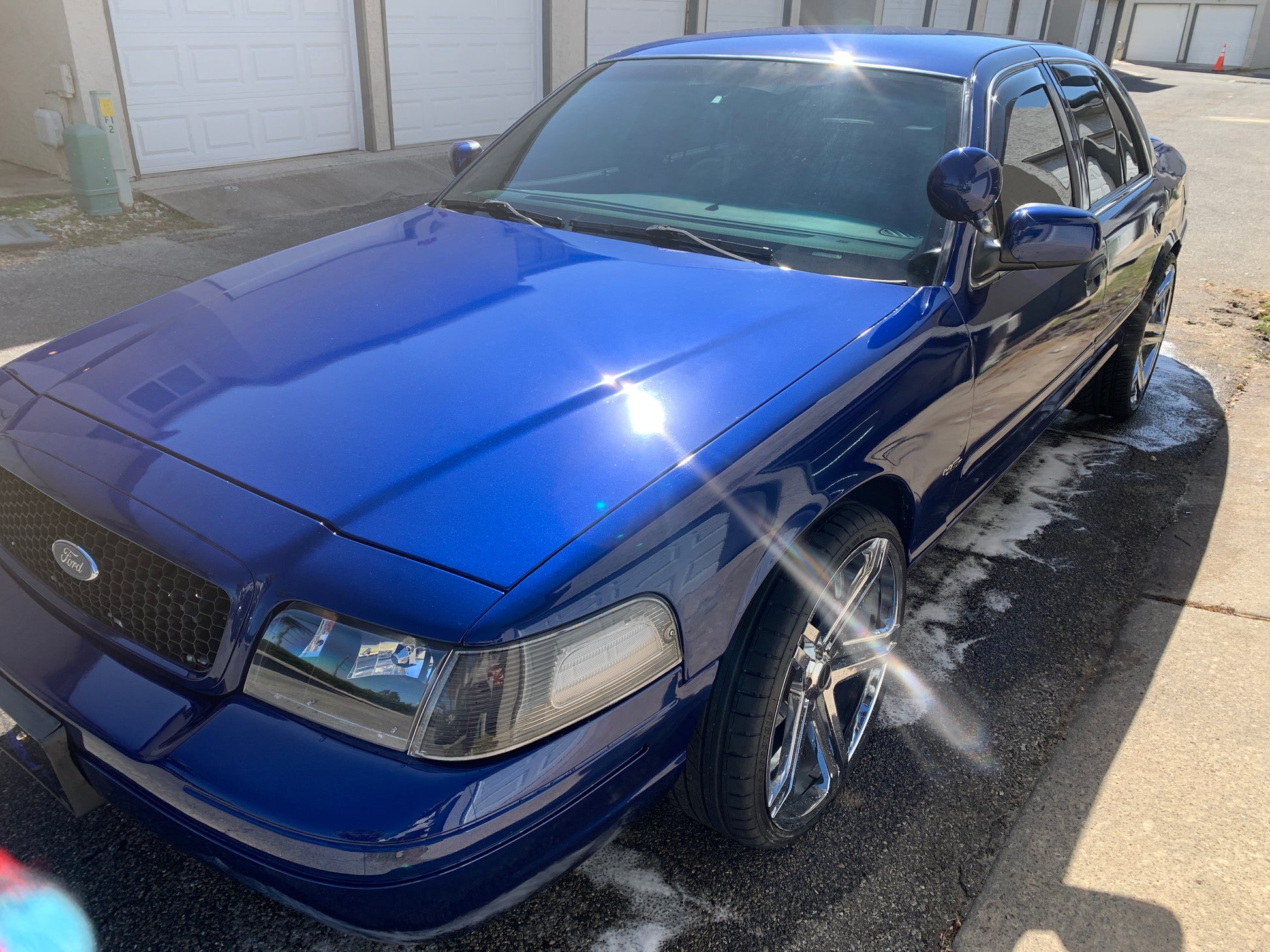 Regular maintenance for a blue Ford Interceptor, visiting every two weeks to maintain the ceramic coating and preserve its shine.