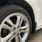 Shiny and clean rims and tires of a vehicle after a professional auto detailing service, showcasing a high-gloss finish and spotless cleaning.