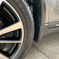 Close-up of a car's wheels looking shiny and protected after professional detailing, showcasing a spotless finish and tire conditioning