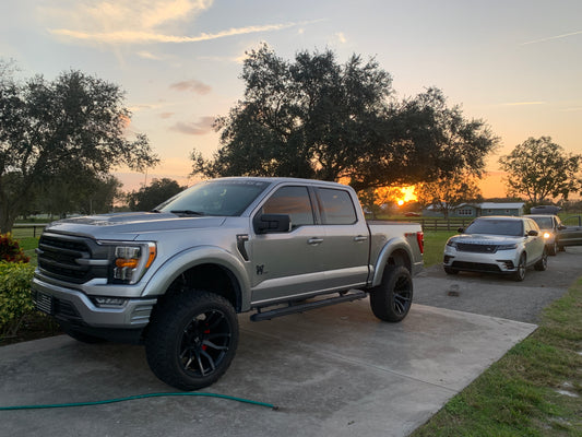 Ridgeline and Range Rover showing off their glossy finish after receiving our premium Graphene Ceramic Coating, providing long-lasting protection and shine.